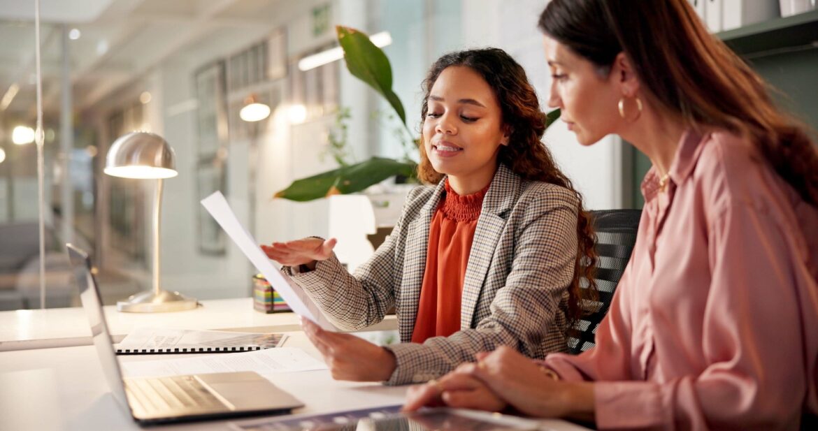 Two professionals reviewing provider documentation